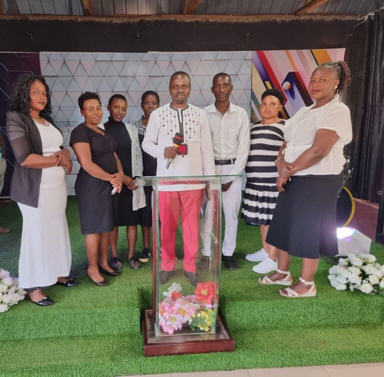Leaders of Tusubira Global Ministries gathered around the pulpit during a service
